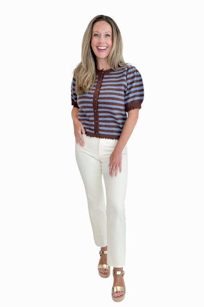 Front view of woman wearing Swagger Boutique’s Brown &amp; Blue Stripe Short Sleeve Cardigan by Entro with jeans against white studio background.