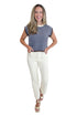 Front view of woman wearing Swagger Boutique’s Brown & Blue Striped Sleeveless Sweater by Entro with jeans against white studio background.