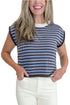 Front detail view of woman wearing Swagger Boutique’s Brown & Blue Striped Sleeveless Sweater by Entro with jeans against white studio background.