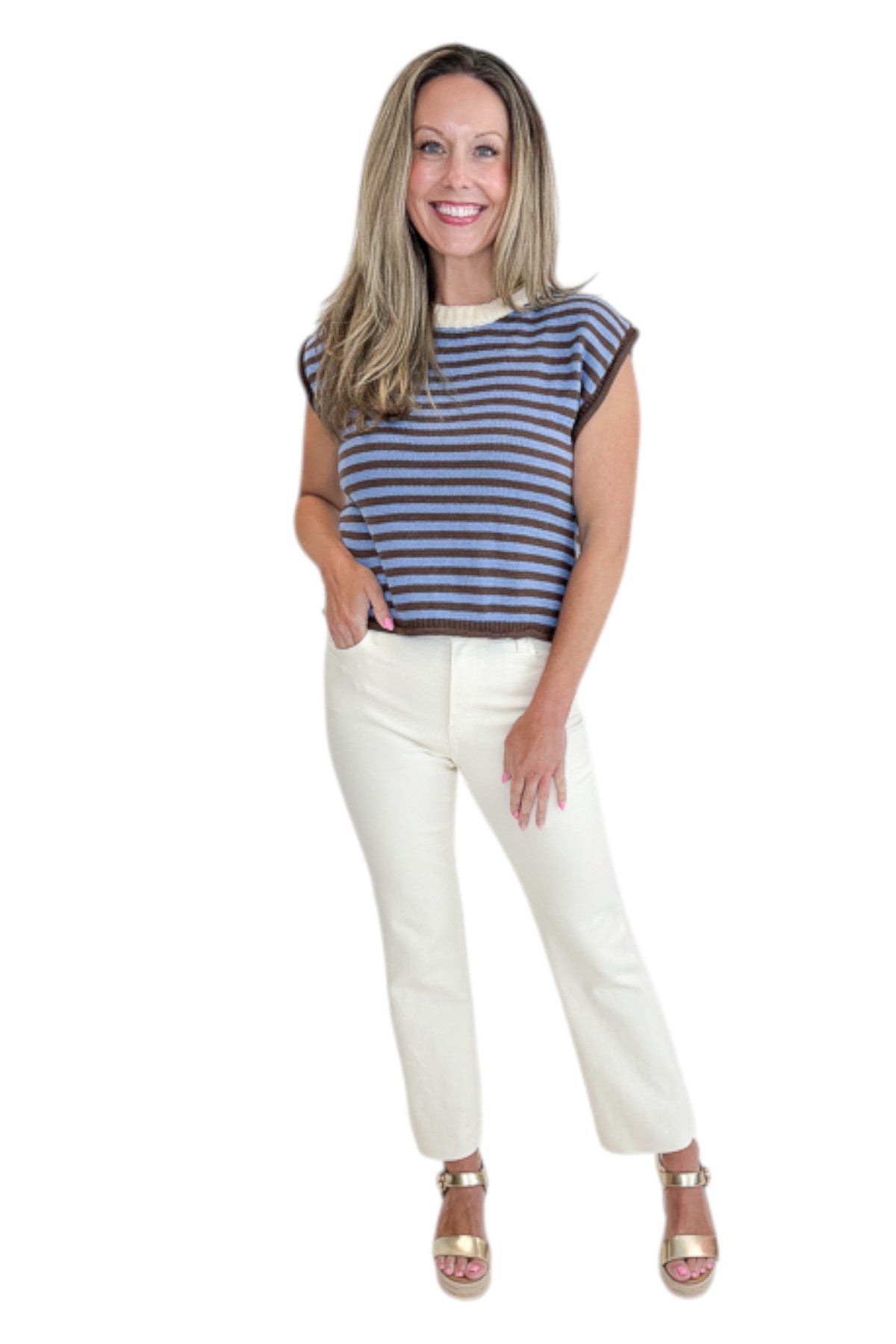 Front view of woman wearing Swagger Boutique’s Brown &amp; Blue Striped Sleeveless Sweater by Entro with jeans against white studio background.