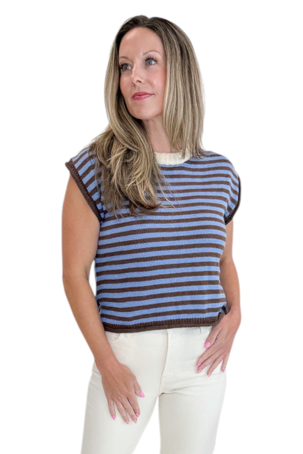 Front view of woman wearing Swagger Boutique’s Brown &amp; Blue Striped Sleeveless Sweater by Entro with jeans against white studio background.