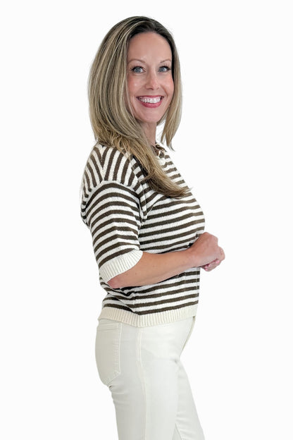 Side view of woman wearing Swagger Boutique’s Brown &amp; Cream Striped Short Sleeve Sweater with jeans against white studio background.