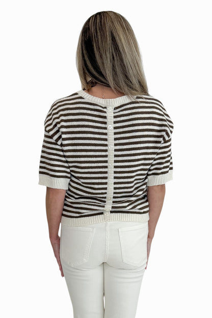 Back view of woman wearing Swagger Boutique’s Brown &amp; Cream Striped Short Sleeve Sweater with jeans against white studio background.