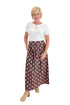 Front view of woman wearing Swagger Boutique’s Brown & Pink Floral Print Skirt with top against white studio background.