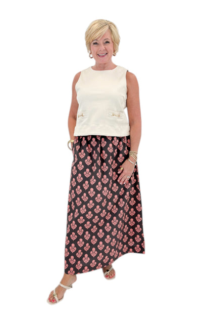 Front view of woman wearing Swagger Boutique’s Brown &amp; Pink Floral Print Skirt with top against white studio background.