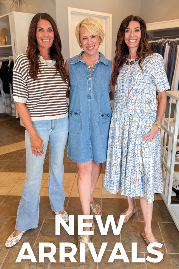 three woman together wearing Brown and Cream striped short sleeve sweater with medium wash sleeveless denim midi dress with blue and brown abstract print short sleeve top 