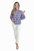 Front view of woman wearing Swagger Boutique’s Burgundy & Blue Floral Print Long Sleeve Top by Entro with jeans against white studio background.