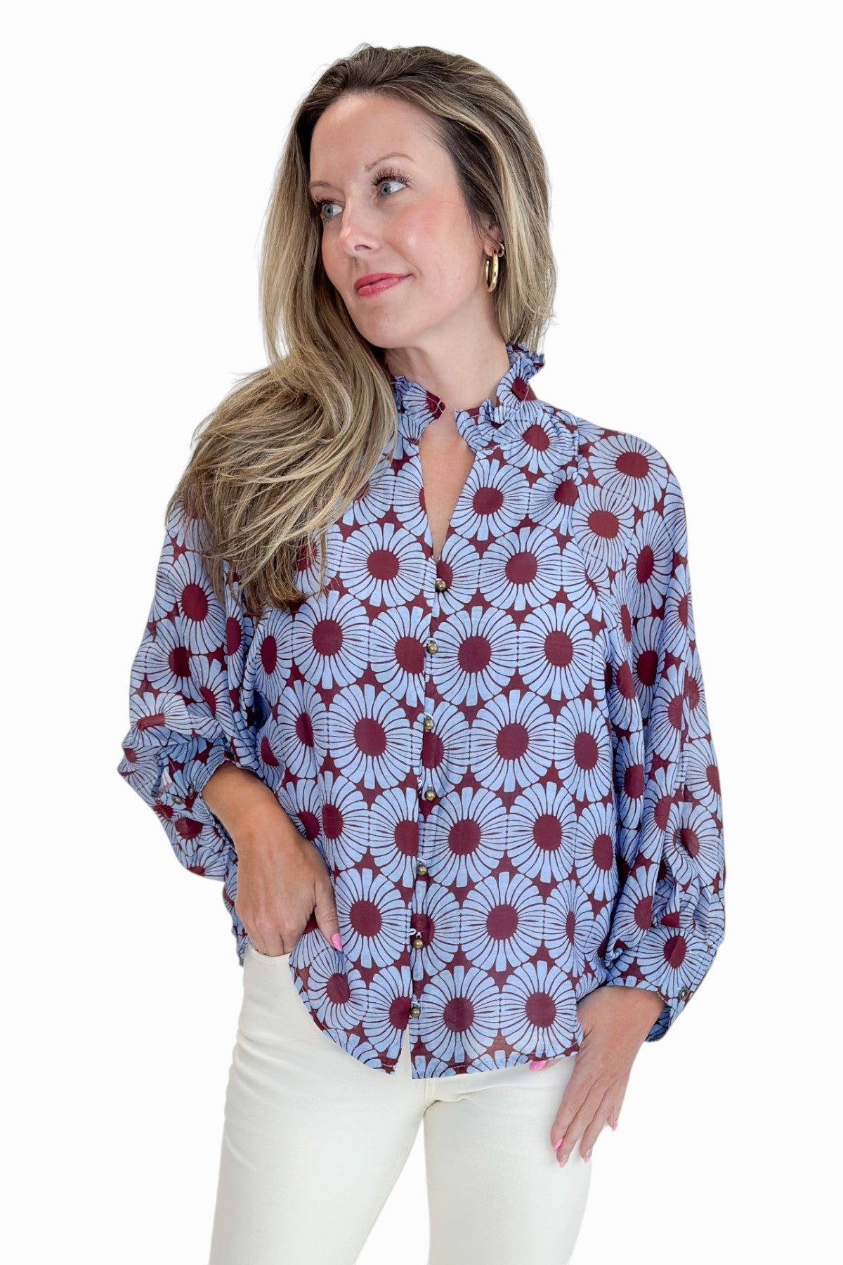 Front view of woman wearing Swagger Boutique’s Burgundy &amp; Blue Floral Print Long Sleeve Top by Entro with jeans against white studio background.