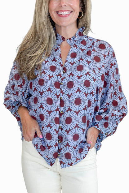 Front detail view of woman wearing Swagger Boutique’s Burgundy &amp; Blue Floral Print Long Sleeve Top by Entro with jeans against white studio background.