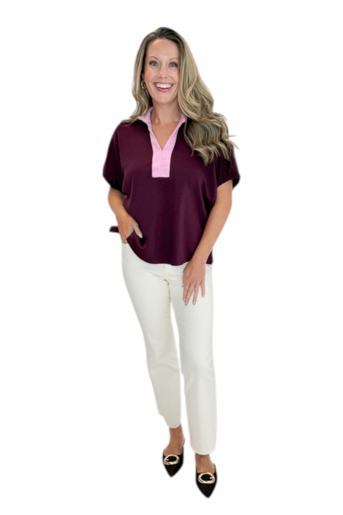 Front view of woman wearing Swagger Boutique’s Burgundy &amp; Pink Contrast Dolman Sleeve Top by Entro with jeans against white studio background.