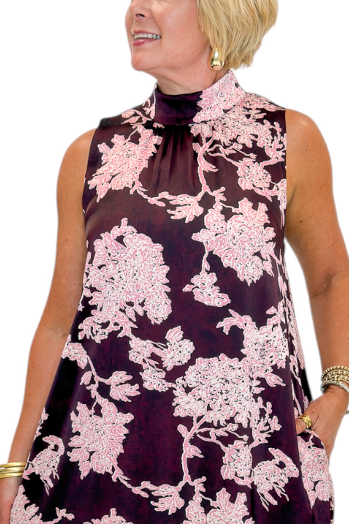 Front detail view of woman wearing Swagger Boutique’s Burgundy &amp; Pink Printed Maxi Dress by Entro with sandals against white studio background.