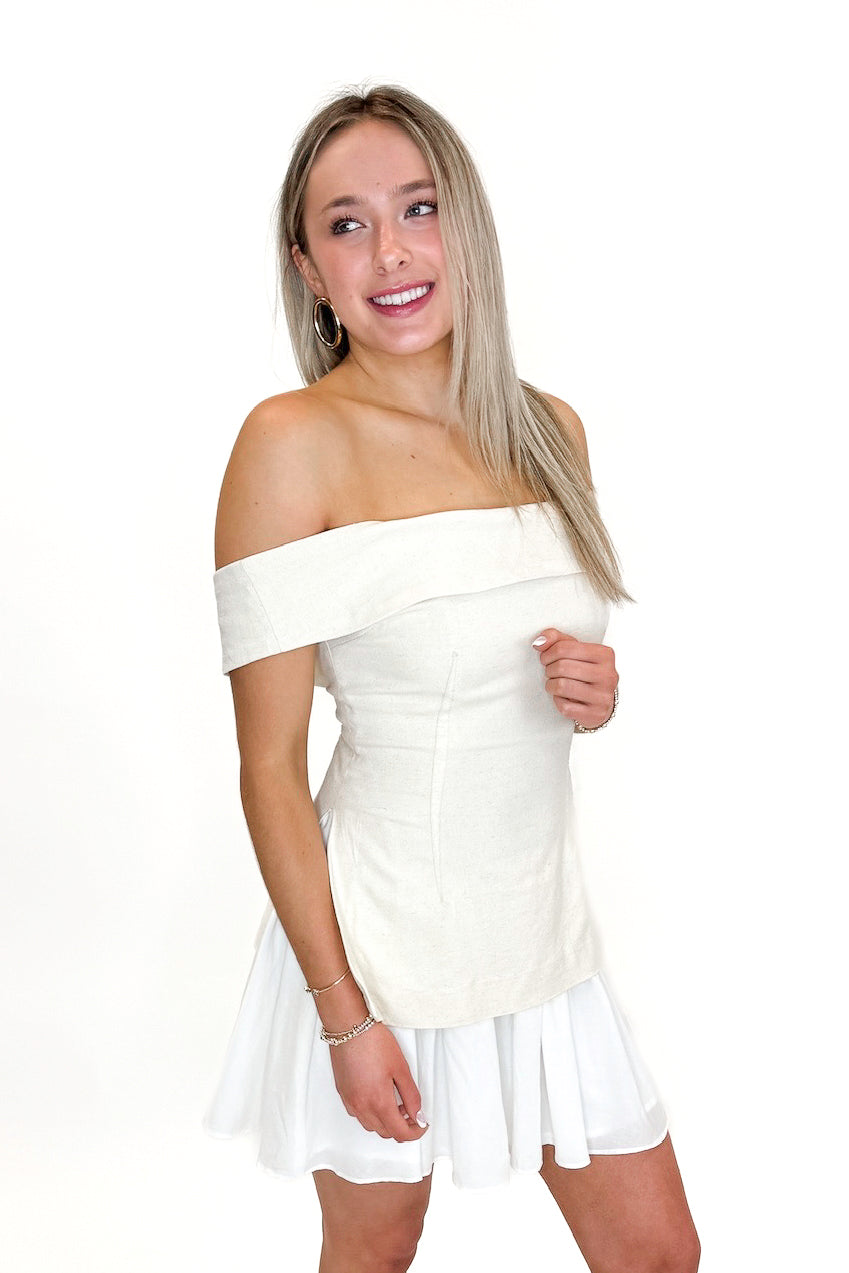 Front view of woman wearing Oatmeal Off The Shoulder Layered Dress against white studio background.