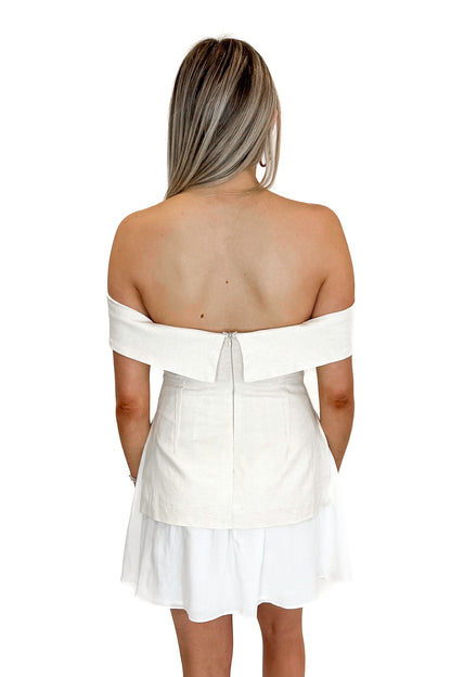 Back view of woman wearing Oatmeal Off The Shoulder Layered Dress against white studio background.