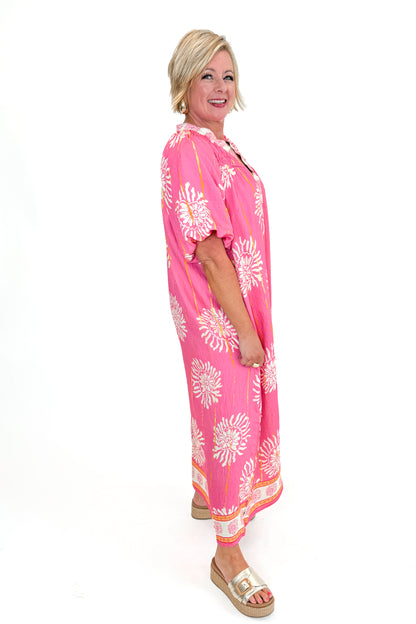 Side view of woman wearing Pink Printed Midi Dress against white studio background.