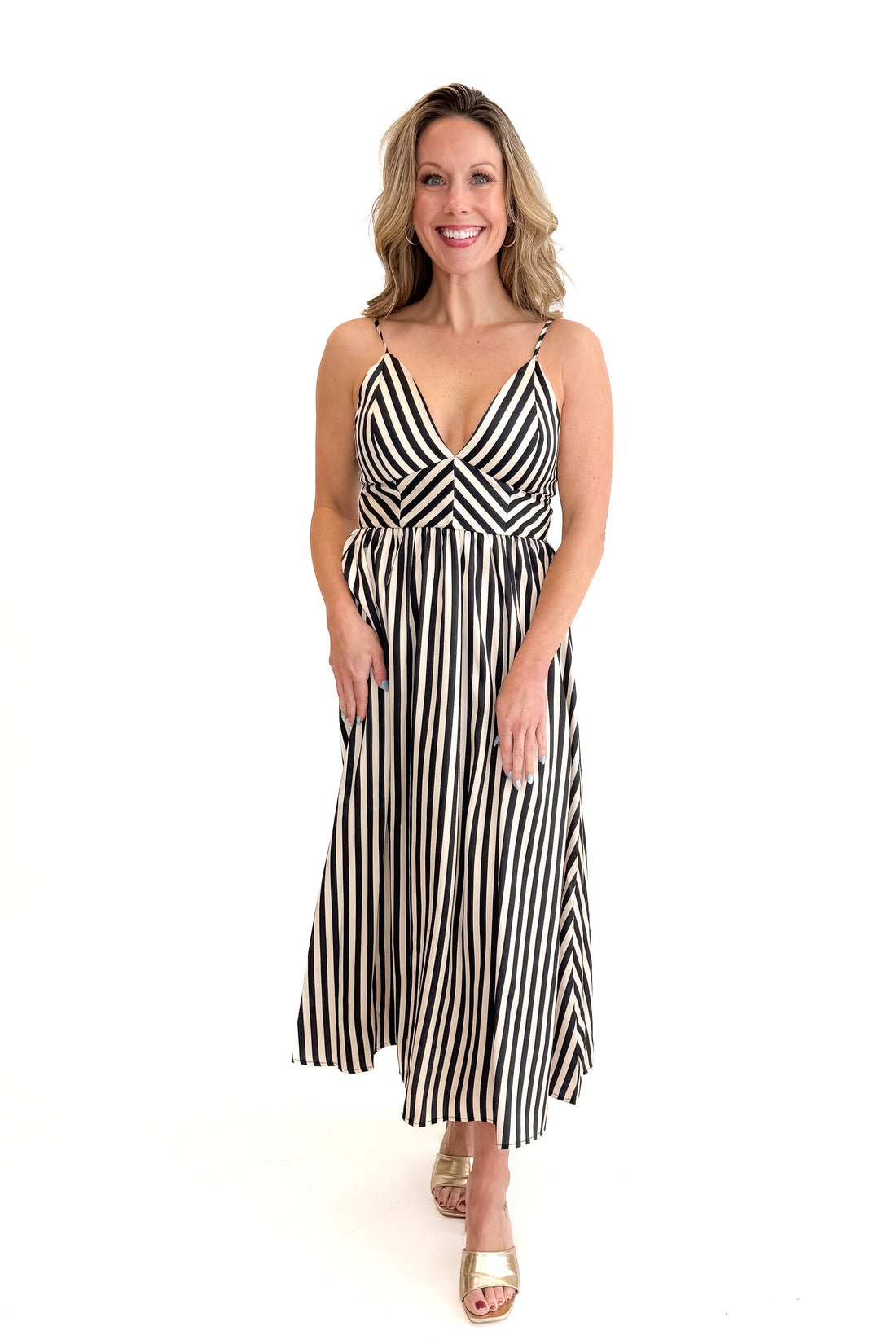 Front view of woman wearing Cream Satin Striped Midi Dress against white studio background.