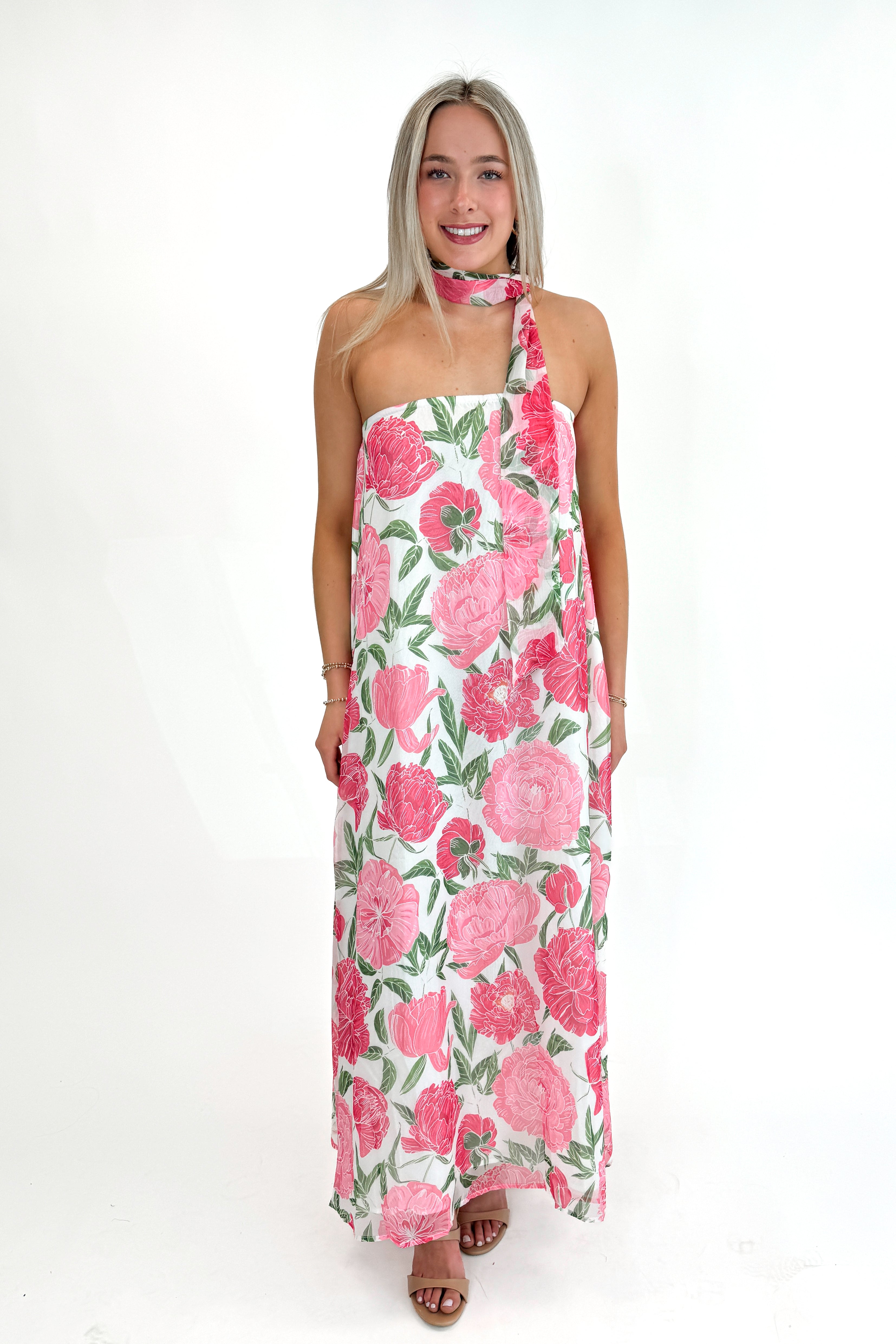 Front view of woman wearing Pink Floral Maxi Dress With Convertible Scarf against white studio background.
