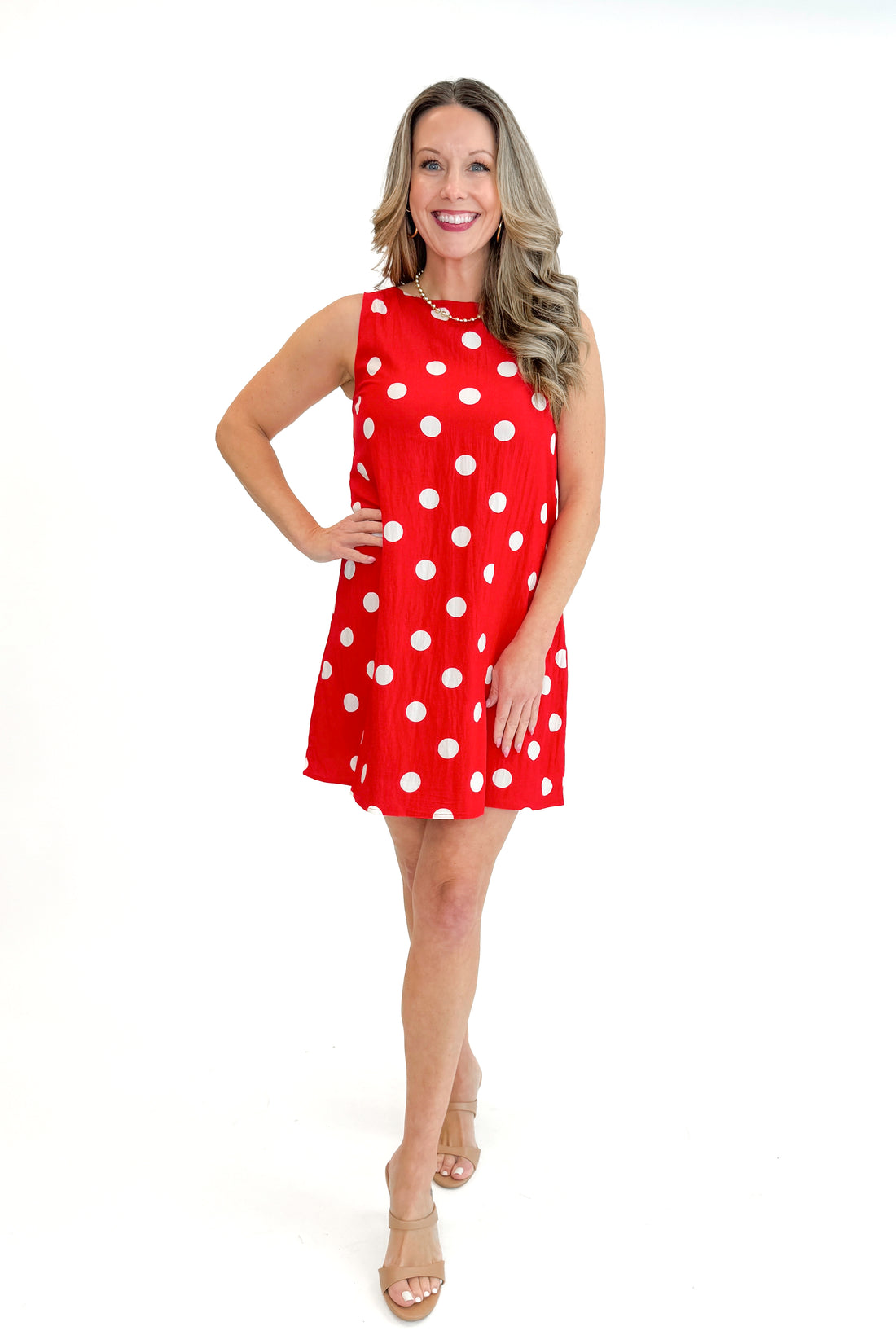 Front view of woman wearing Red &amp; White Polka Dot Shift Dress against white studio background.