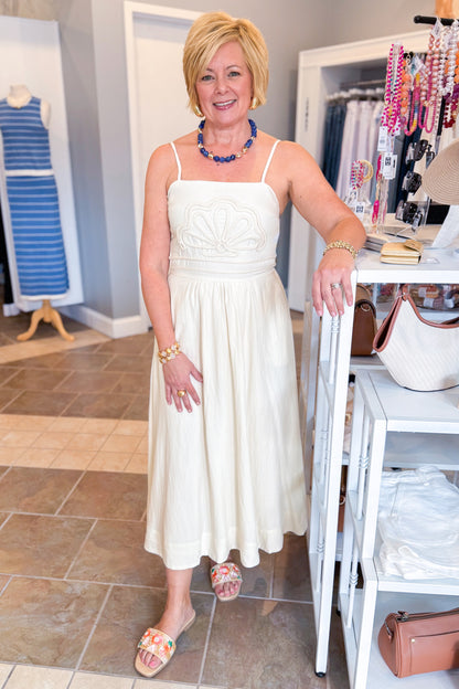 Front view of woman wearing Cream Shell Embroidered Midi Dress by TCEC with sandals at Swagger Boutique.