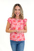 Front view of woman wearing Pink Floral Printed Ruffle Sleeve Top with jeans against white studio background.