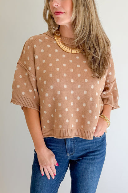 Front detail view of woman wearing Swagger Boutique’s Camel Polka Dot Short Sleeve Sweater by Entro with jeans against white studio background.