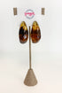 front view of brown turquiose colored hoop earrings on earrings display 