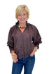 Front view of woman wearing Swagger Boutique’s Chocolate Lace Lined Top by Entro with jeans against white studio background.