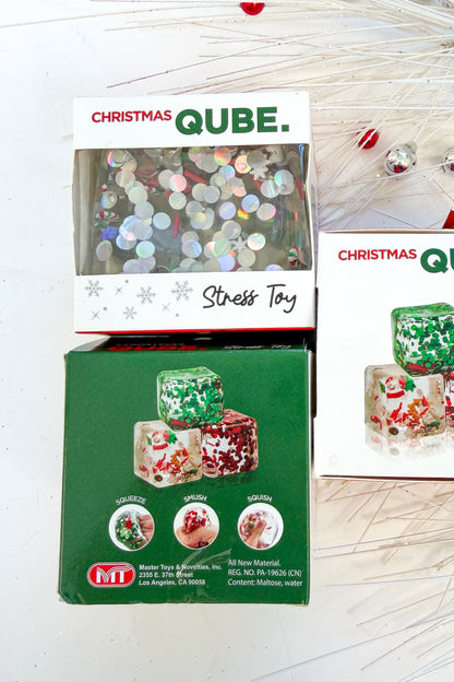 Christmas Qube against holiday background