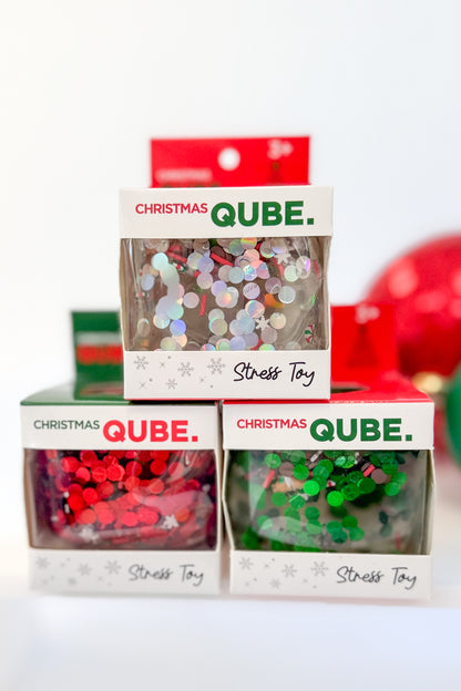 Christmas Qube against holiday background