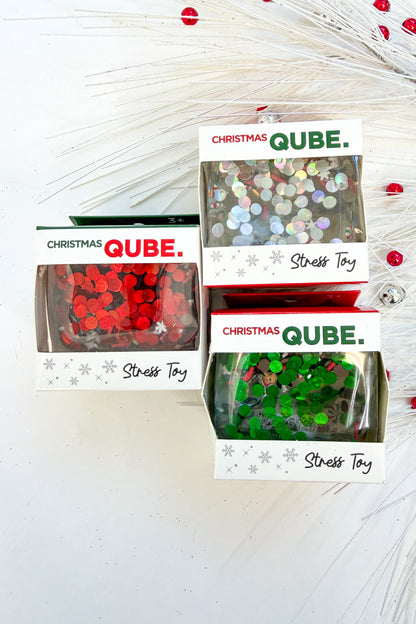 Christmas Qube against holiday background