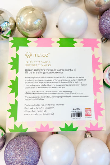 Christmas Shower Steamers against holiday background.