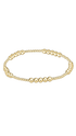 Gold bracelet on a plain white background