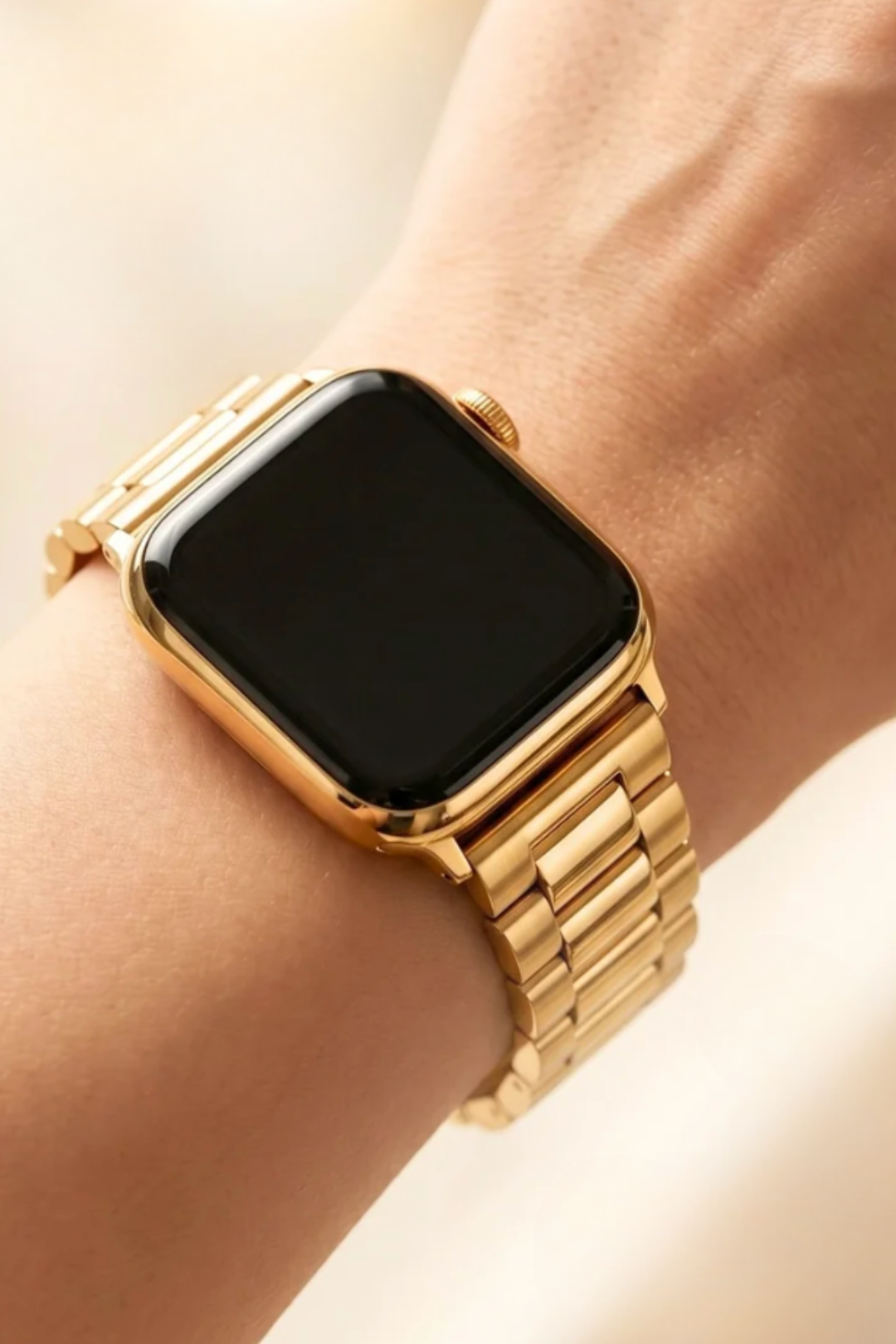 A gold-toned smartwatch band with a thick, chunky chain-link design and a rectangular black face, shown on a plain white background.