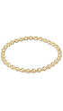 A gold beaded stretch bracelet with polished round beads, displayed in a horizontal oval shape against a plain white background.
