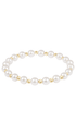 A stretch bracelet featuring pearls and small gold beads, displayed against a solid white background.