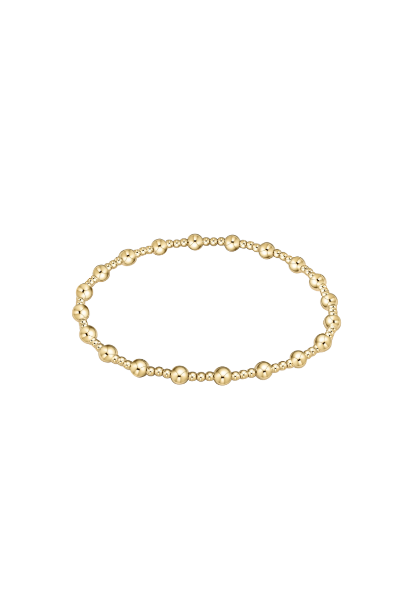 Gold bracelet on a white background