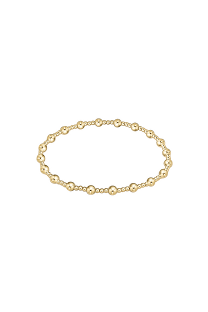 Gold bracelet on a white background