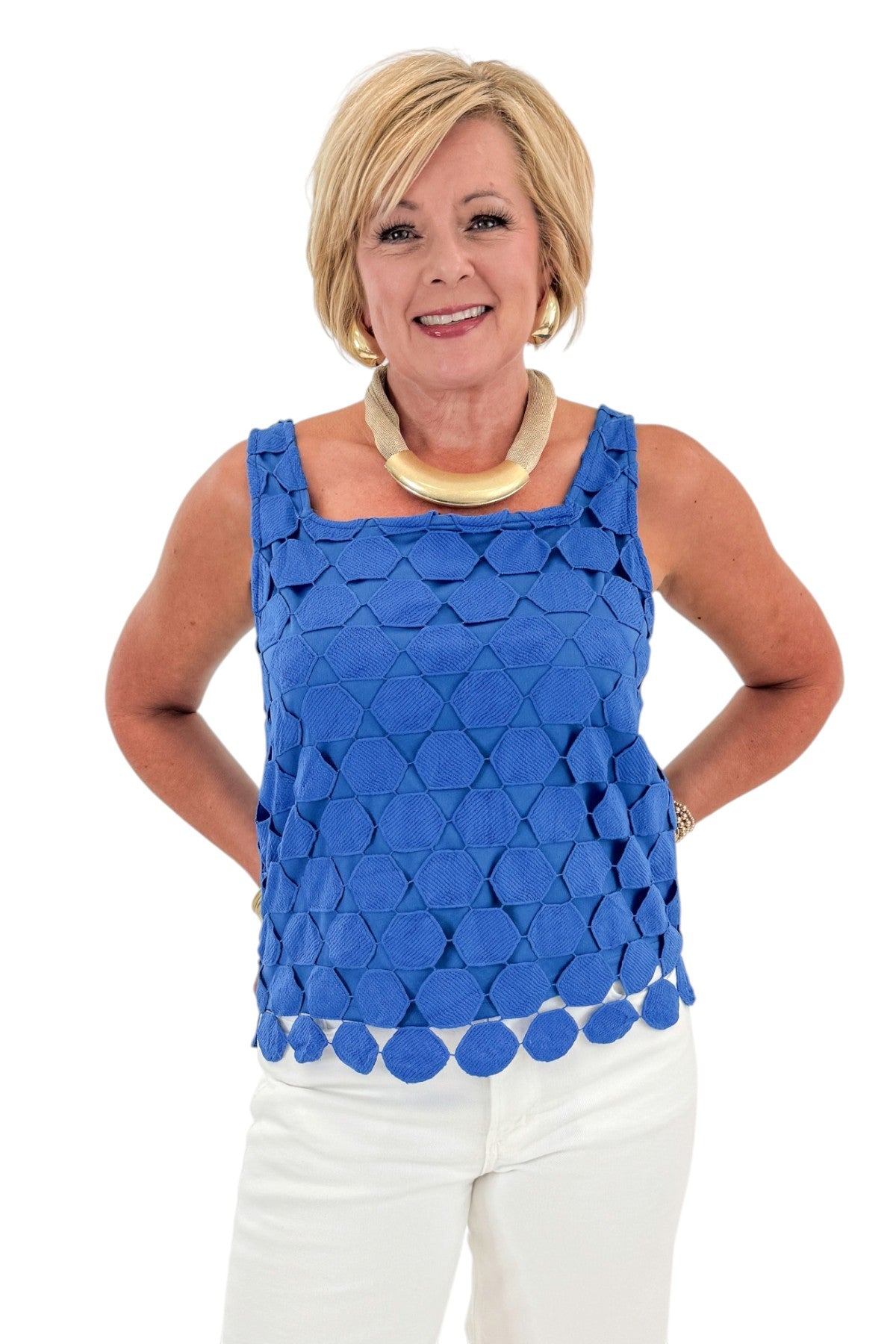 Front view of woman wearing Swagger Boutique’s Cobalt Sleeveless Lace Tank with jeans against white studio background.