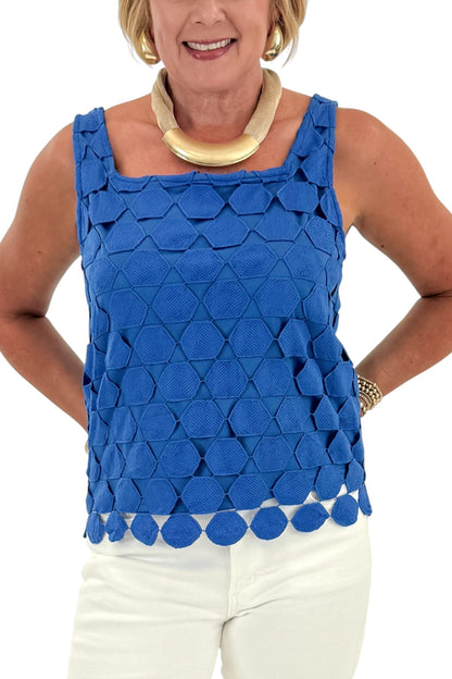 Front detail view of woman wearing Swagger Boutique’s Cobalt Sleeveless Lace Tank with jeans against white studio background.