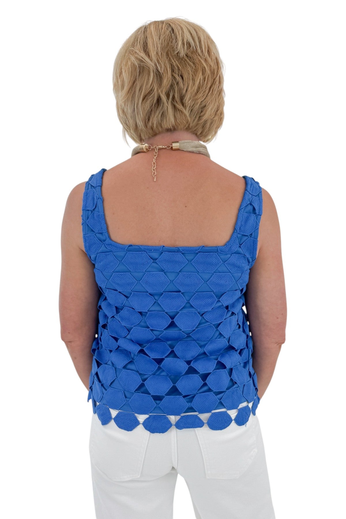 Back view of woman wearing Swagger Boutique’s Cobalt Sleeveless Lace Tank with jeans against white studio background.
