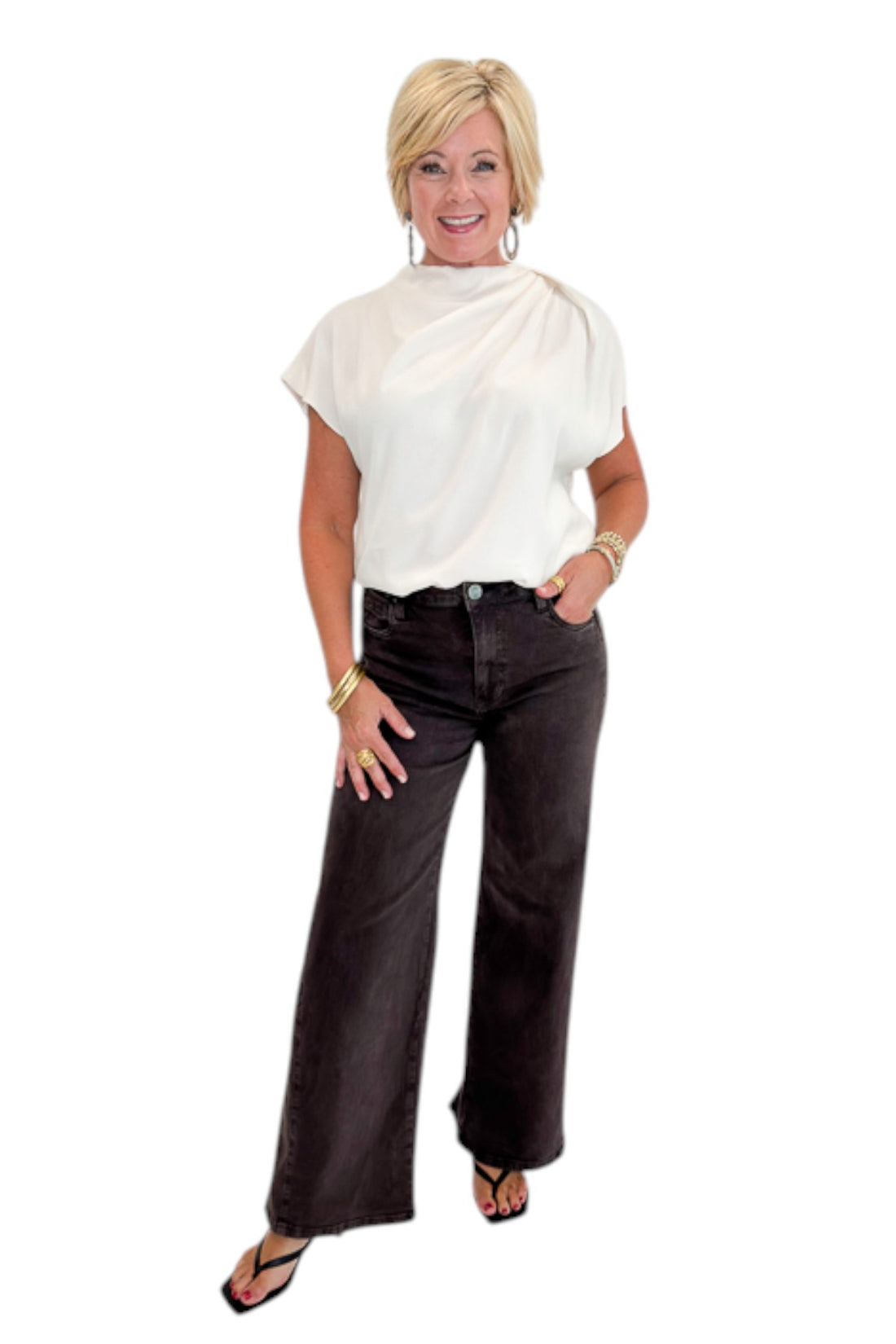 Front view of woman wearing Swagger Boutique’s Cream Cowl Neck Top with jeans against white studio background.