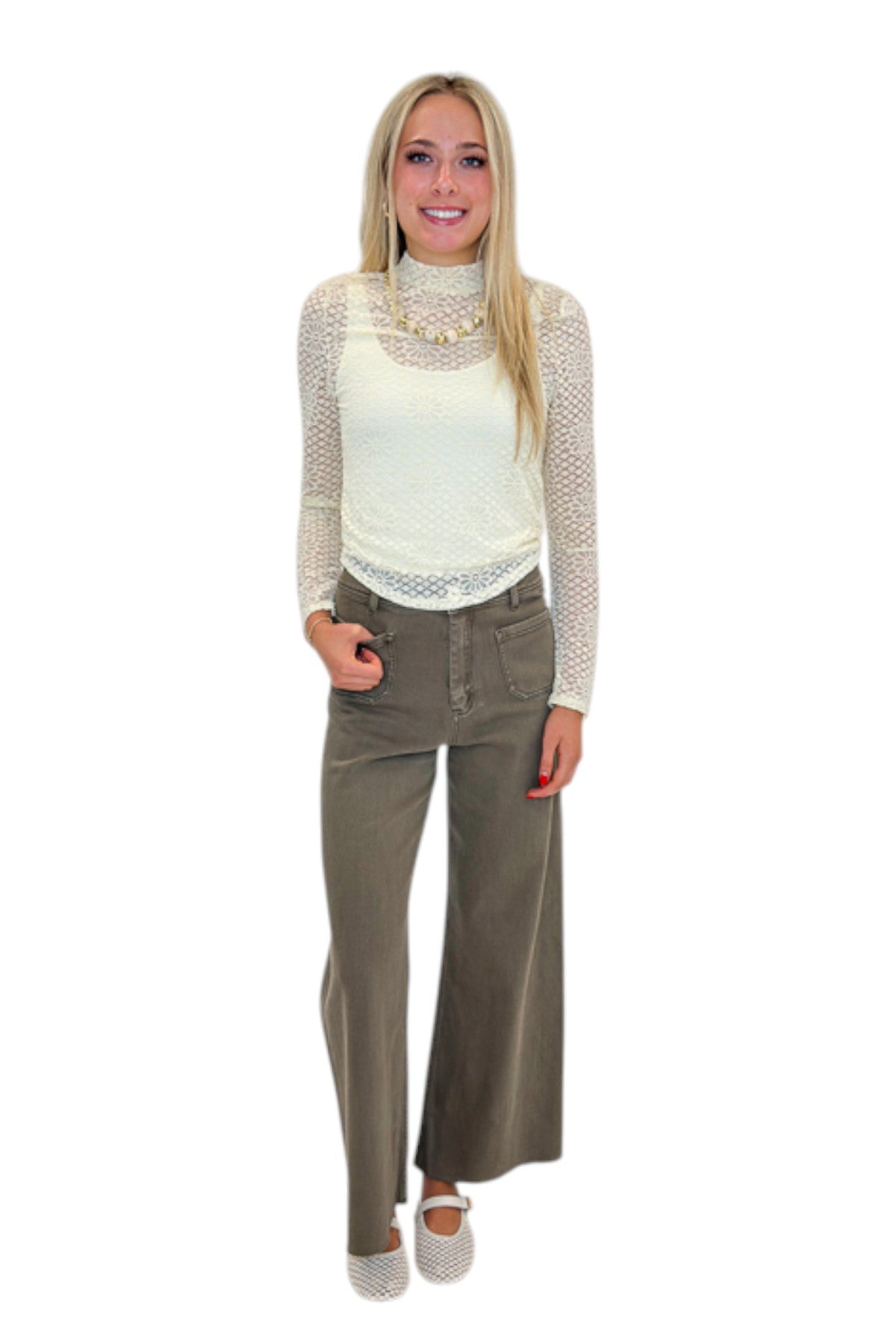 Front view of woman wearing Swagger Boutique’s Cream Floral Lace Top with jeans against white studio background.
