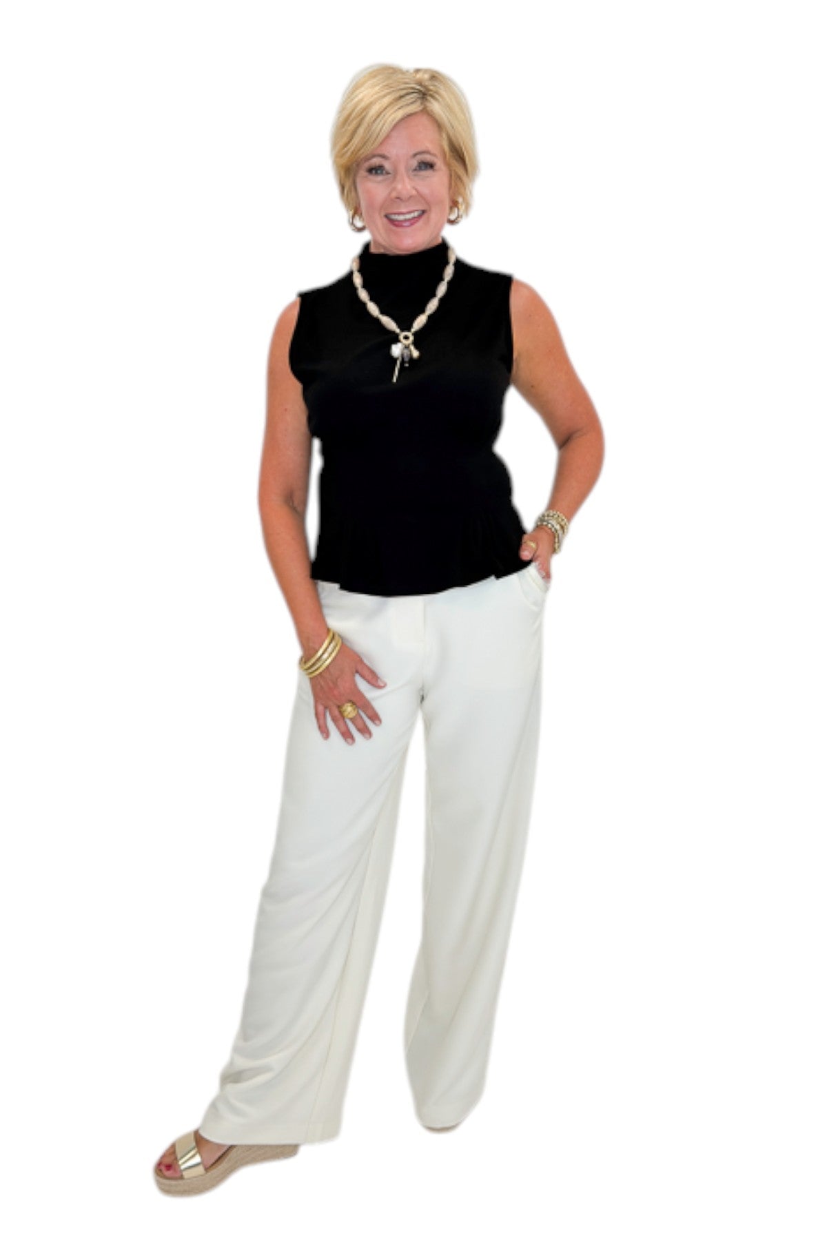 Front view of woman wearing Swagger Boutique’s Cream Lace Lined Pants with top against white studio background.