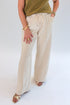 Front view of woman wearing Swagger Boutique’s Cream Suede Pants with sweater against white studio background.
