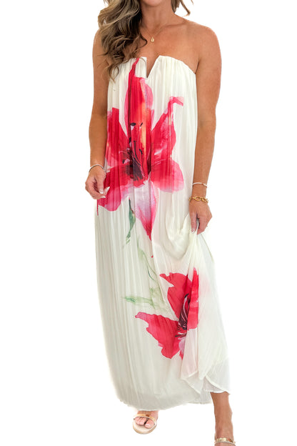 Front detail view of woman wearing Swagger Boutique’s Cream With Large Floral Print Pleat Detail Maxi Dress with sandals against white studio background.