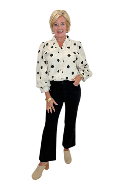 Front view of woman wearing Swagger Boutique’s Cream &amp; Black Polka Dot 3/4 Sleeve Top with Kelsey Black Denim Jeans against white studio background.