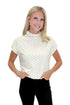 Front view of woman wearing Swagger Boutique’s Cream & Black Polka Dot Mock Neck Top by Entro with jeans against white studio background.