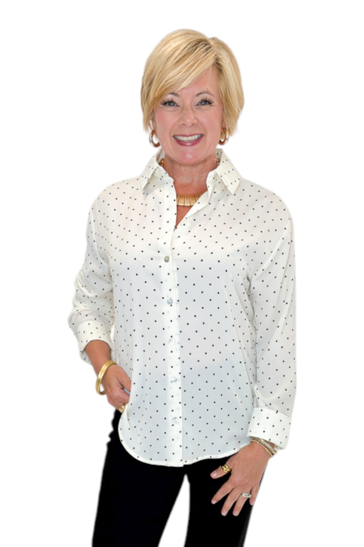 Front view of woman wearing Swagger Boutique’s Cream &amp; Black Polka Dot Satin Button Up Top with jeans against white studio background.