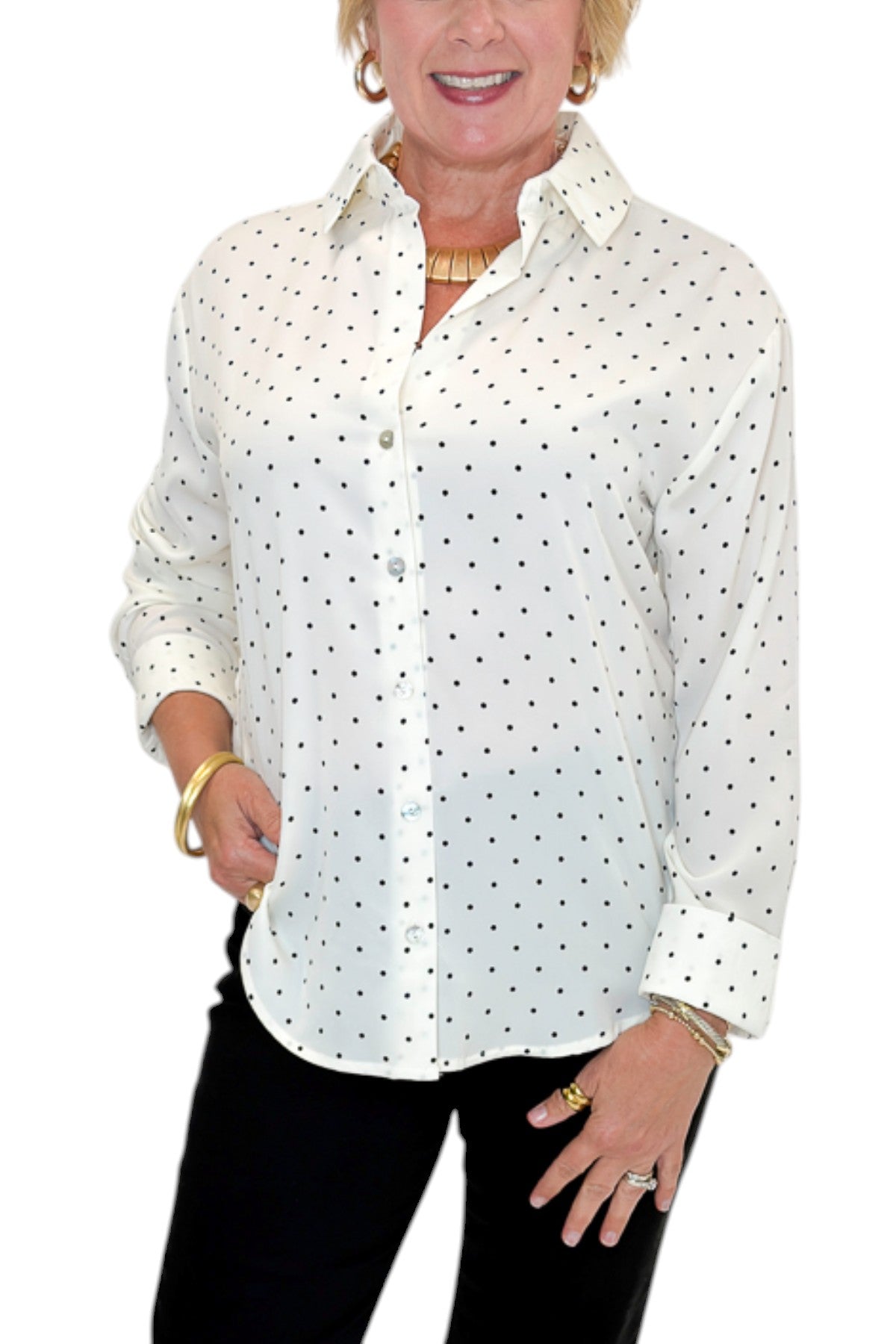 Front detail view of woman wearing Swagger Boutique’s Cream &amp; Black Polka Dot Satin Button Up Top with jeans against white studio background.