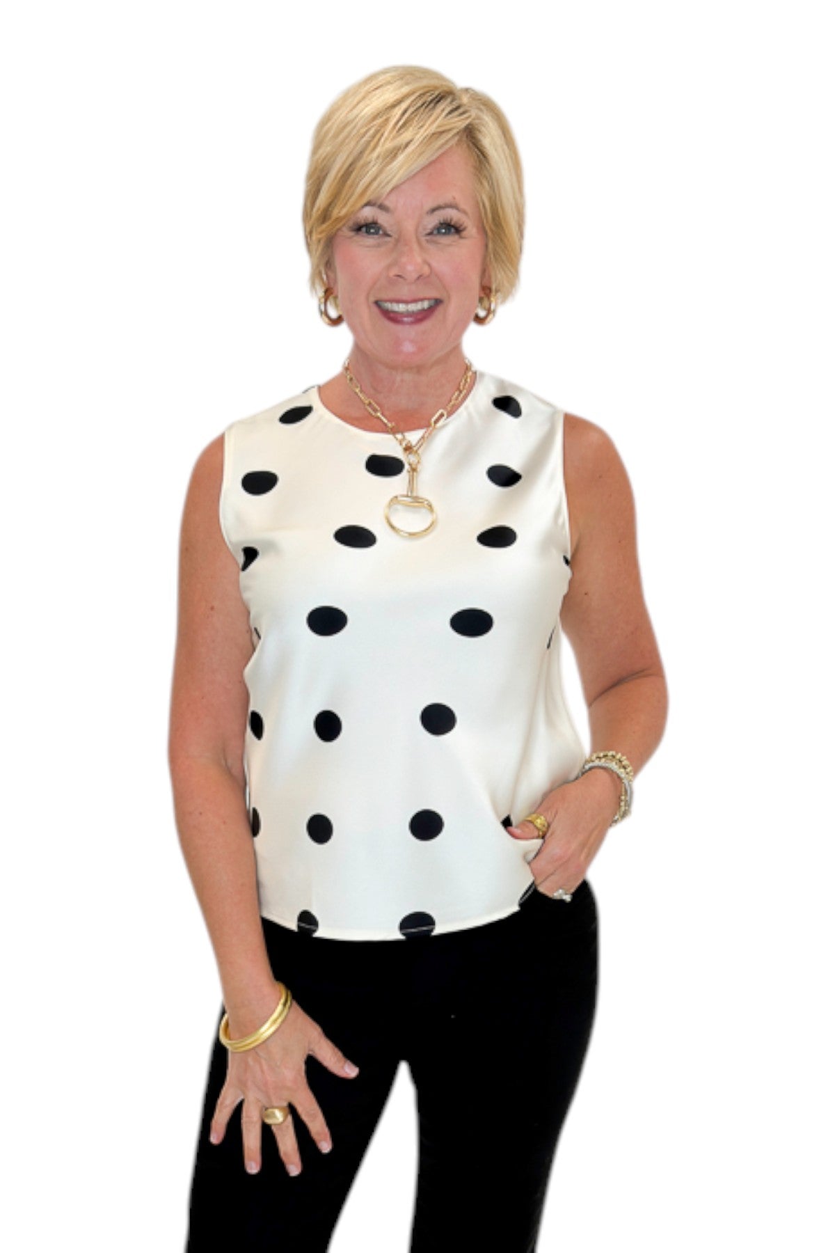 Front view of woman wearing Swagger Boutique’s Cream &amp; Black Polka Dot Satin Tank with jeans against white studio background.