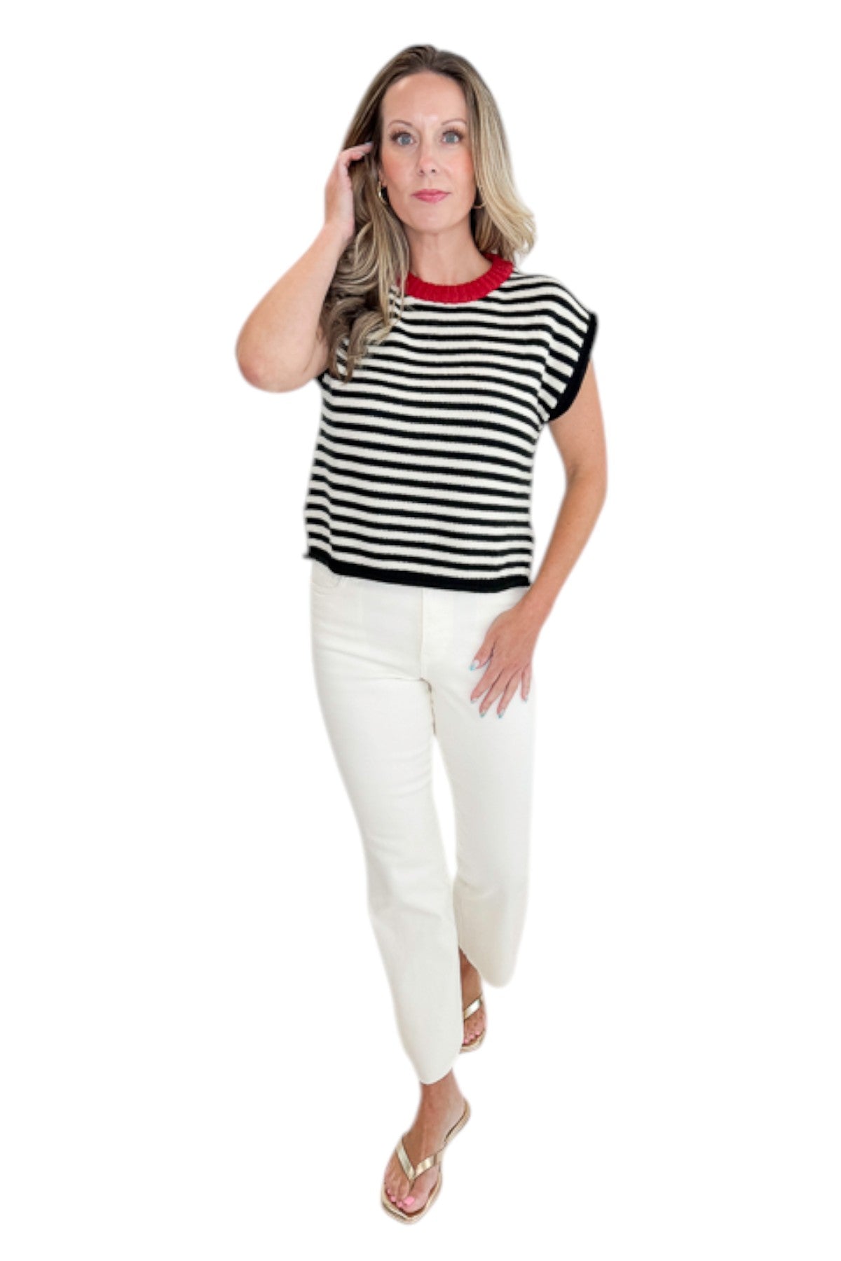 Front view of woman wearing Swagger Boutique’s Cream &amp; Black Striped Sleeveless Sweater with jeans against white studio background.
